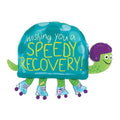 31-inch turtle foil balloon in a purple helmet and roller skates with Wishing You a Speedy Recovery on its teal shell